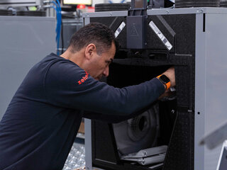 Zehnder recycled production man working on zehnder recycled product