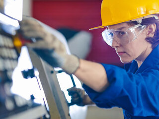 Zehnder Equality zehnder employee women is working on a mashine