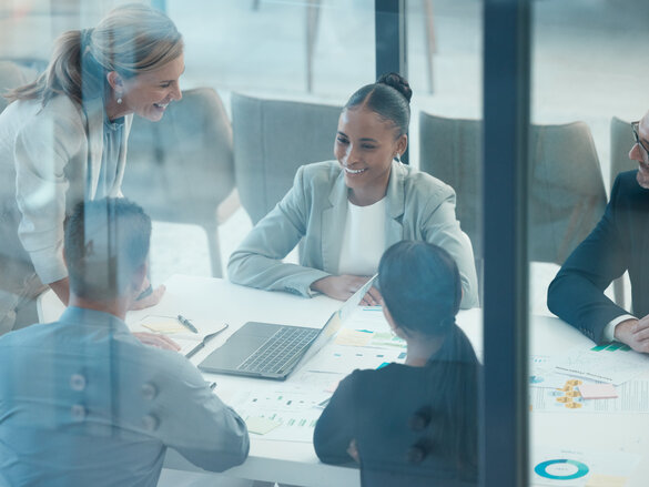 Leader, meeting and presentation with business people behind glass in a finance, data and growth discussion. Teamwork, collaboration and planning with executive team sharing goal, vision and idea.