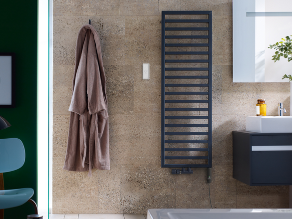 wall of a bathroom with a zehnder quaro design radiator